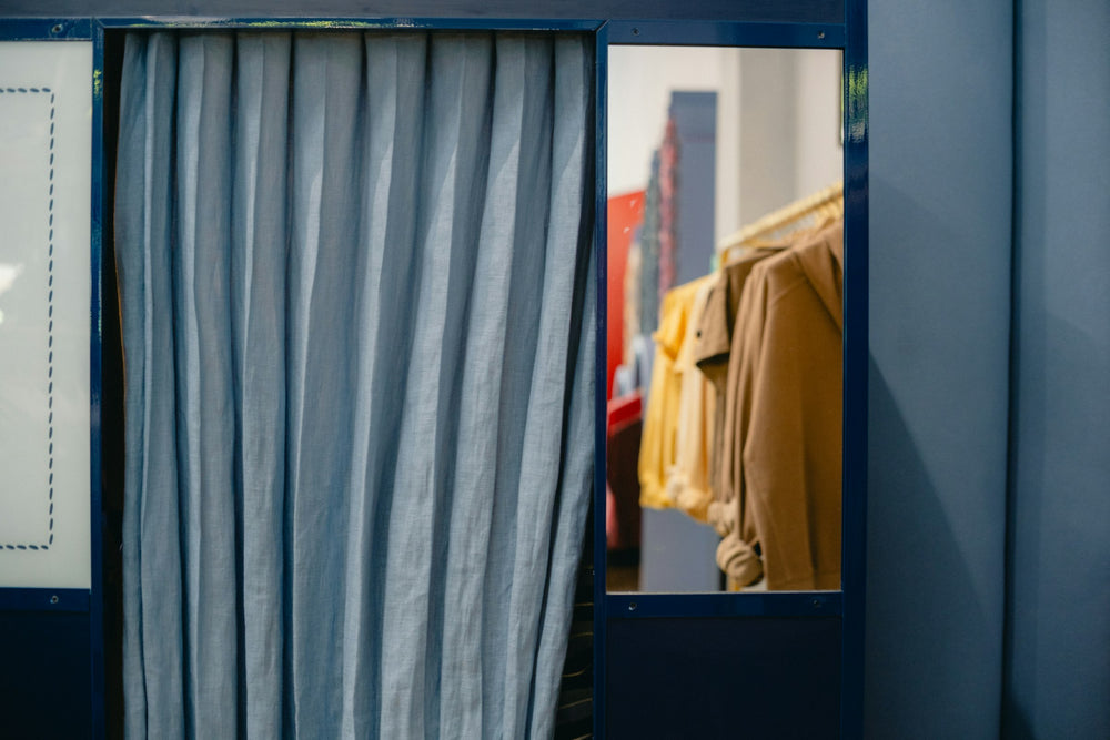 A fitting room with a curtain